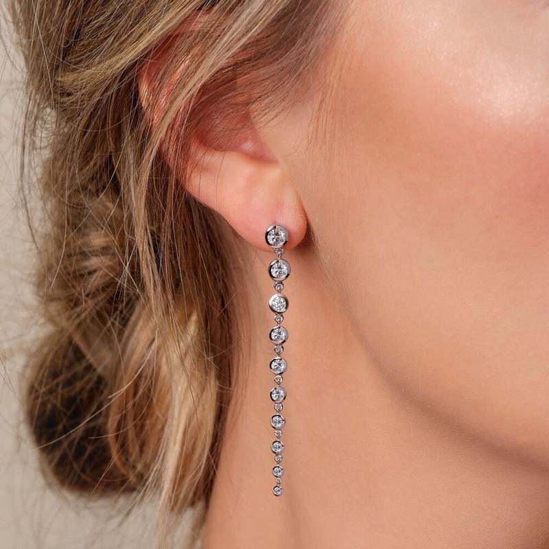 Bezel-set diamond drop earrings in white gold