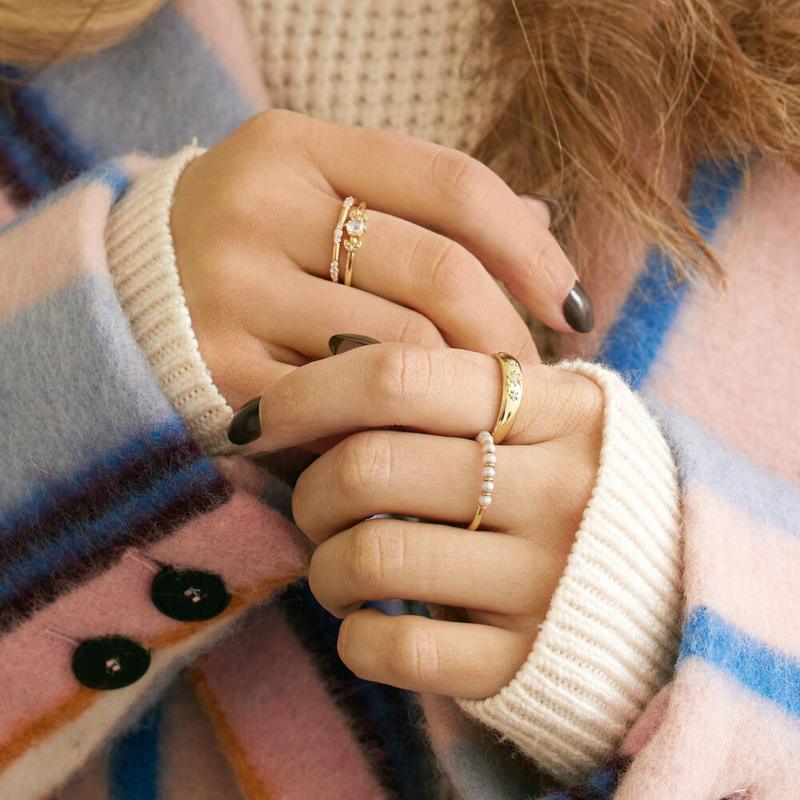Stacked gold rings worn on the hand