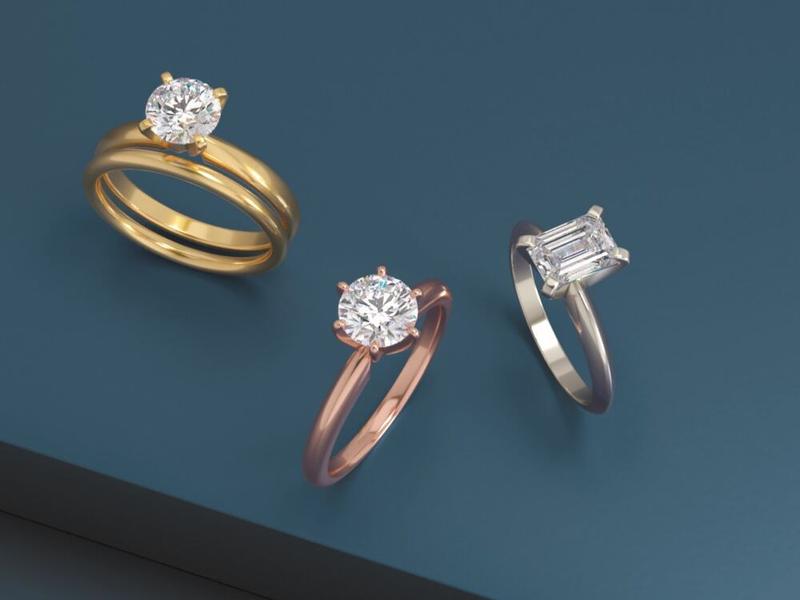 Classic diamond solitaire engagement rings in yellow, rose, and white gold