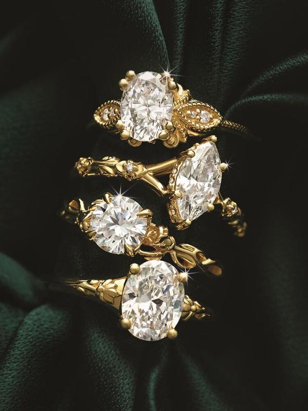 Nature-inspired oval diamond engagement rings in yellow gold