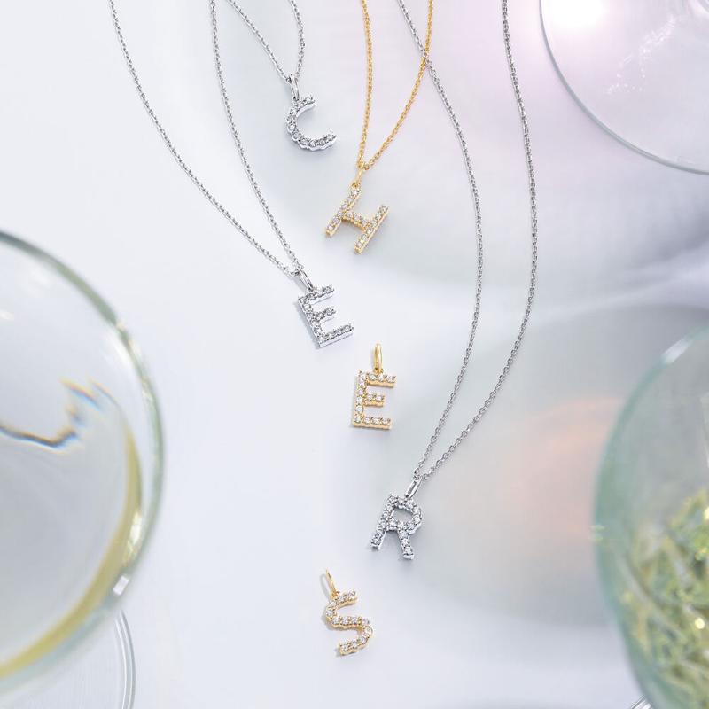 Diamond initial pendant necklaces in gold