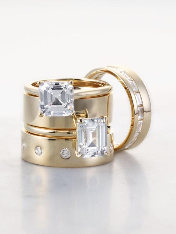 Yellow gold stacking rings with bezel-set diamonds and baguettes