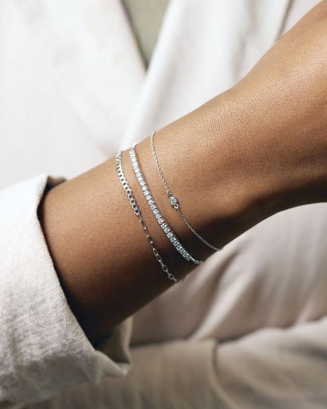 Diamond line and station bracelets in white gold