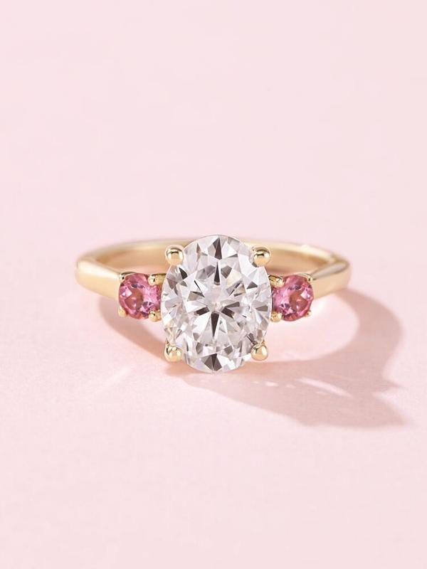 Oval diamond engagement ring with pink tourmaline side stones