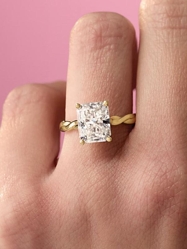 Radiant-cut diamond ring on a twisted gold band