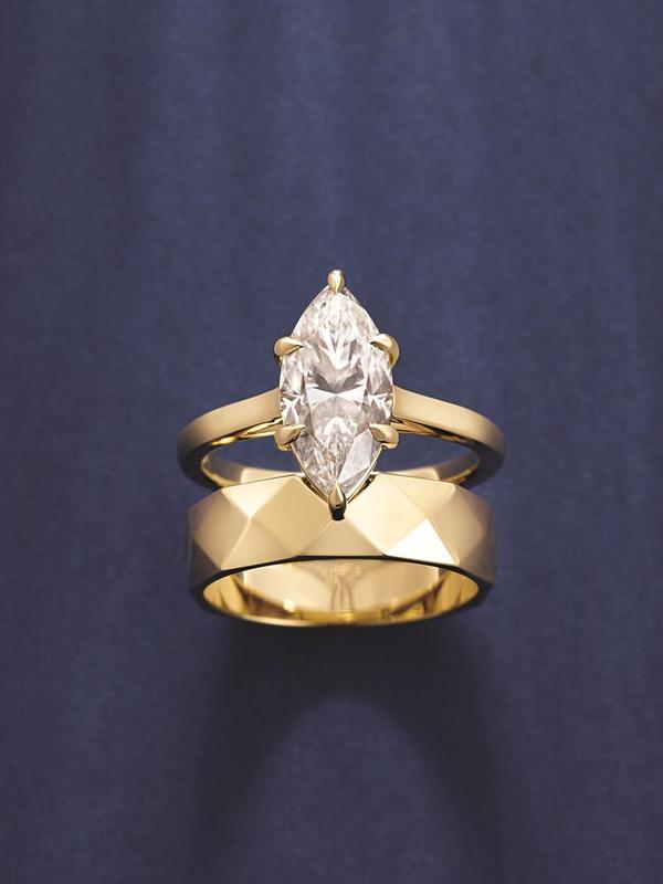 Marquise diamond engagement ring with faceted wide band