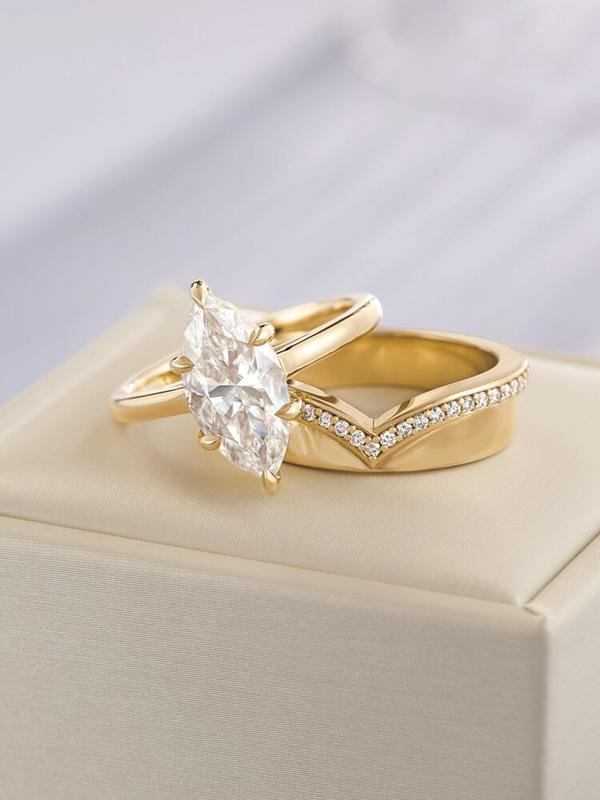 Marquise diamond engagement ring with chevron pavé band