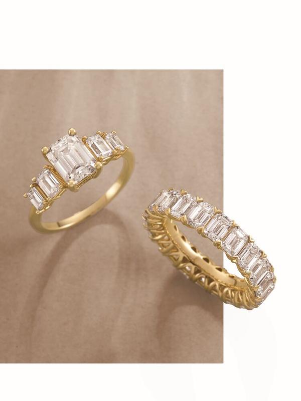 Emerald-cut five-stone diamond ring with eternity band