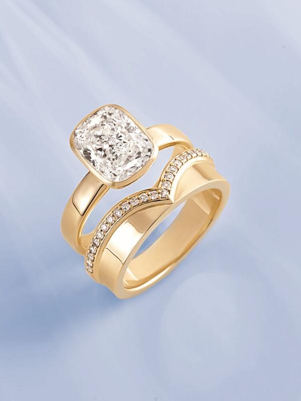 Cushion-cut bezel engagement ring with chevron band stack