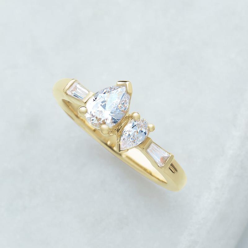Custom design render - pear diamond ring with baguette accents in yellow gold