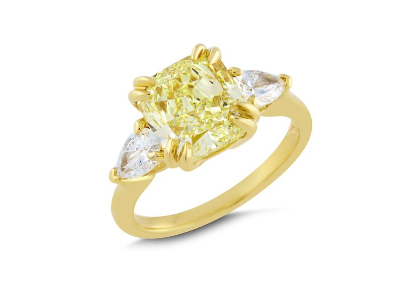 Fancy yellow cushion diamond ring with pear side stones