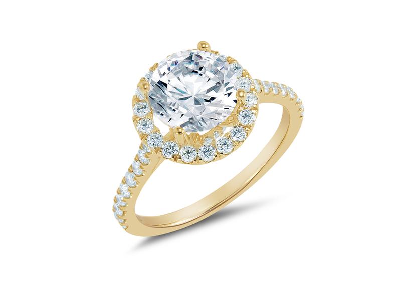 Round diamond halo engagement ring in yellow gold
