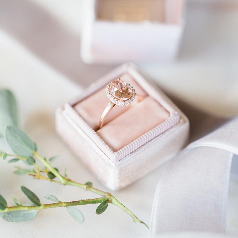 Peach sapphire engagement ring in a blush velvet ring box