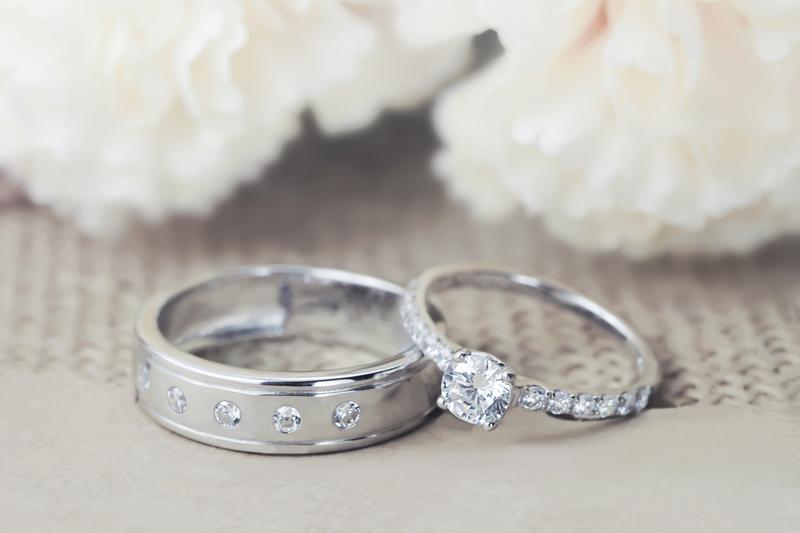 His and hers wedding rings on lace