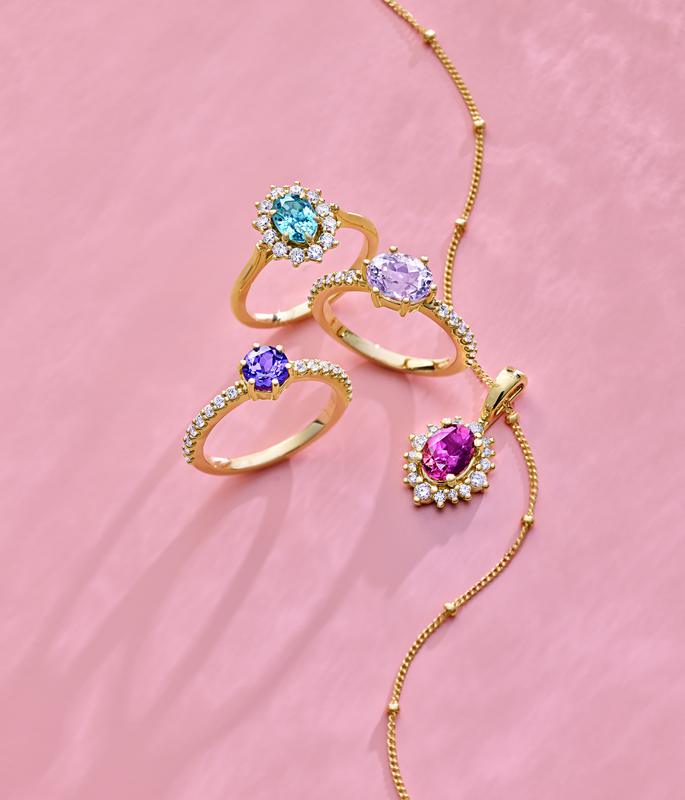 Colored gemstone halo rings and pendant in yellow gold