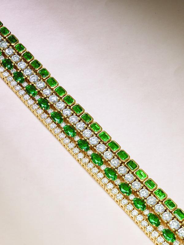 Emerald and diamond tennis bracelets in yellow gold