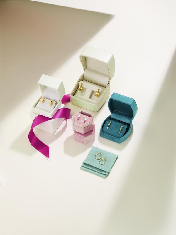 Jewelry gift boxes with gold earrings and rings