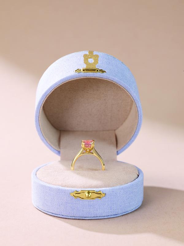 Gold engagement ring in blue velvet ring box