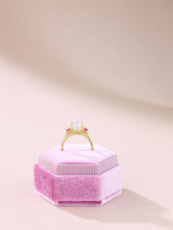 Pink stone engagement ring in pink velvet ring box