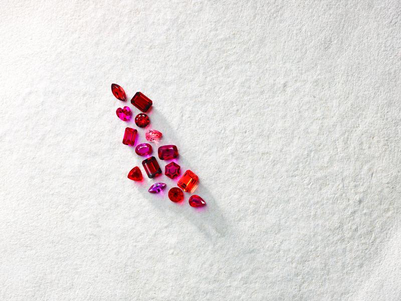 Loose ruby and pink gemstones awaiting a custom setting