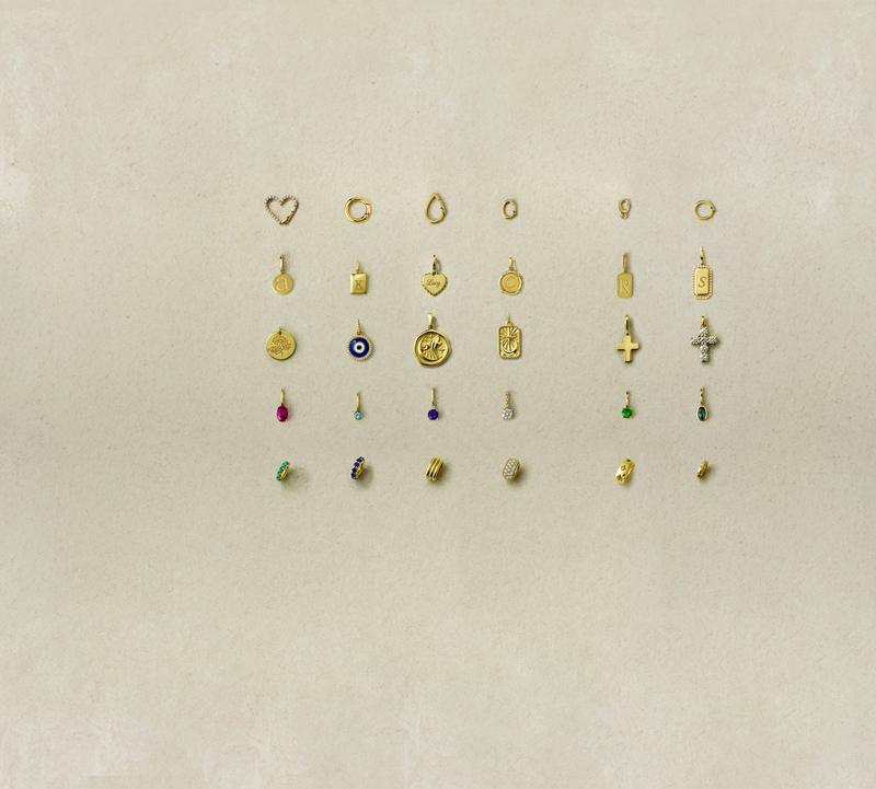Gold charm collection flat lay