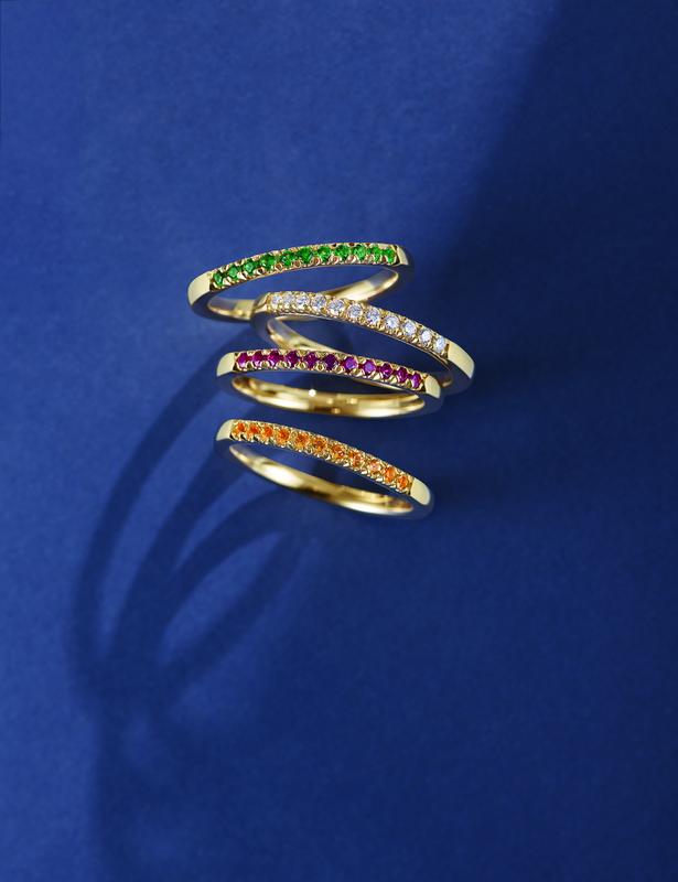 Gemstone eternity stacking bands in yellow gold