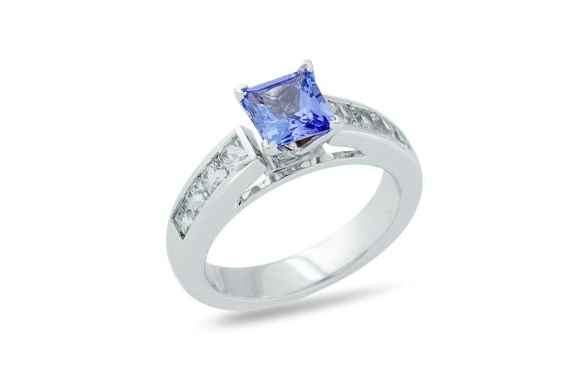 Custom sapphire engagement ring with diamond accents in white gold