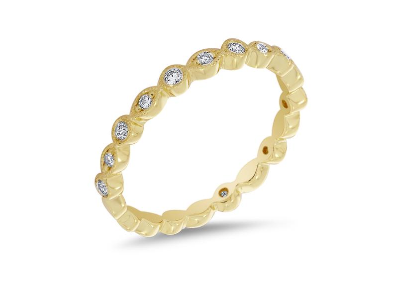 Custom yellow gold bezel-set diamond eternity band