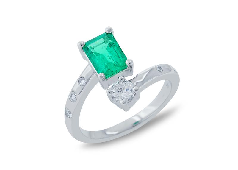 Custom emerald and diamond bypass ring in white gold